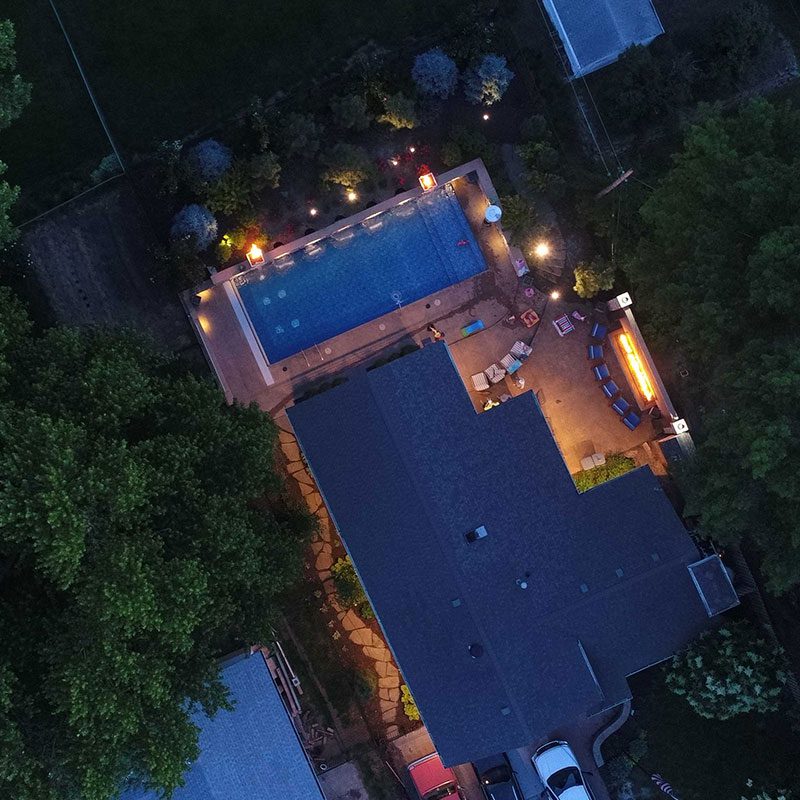 aerial view from omaha landscaping company of a pool and extensive landscaping design